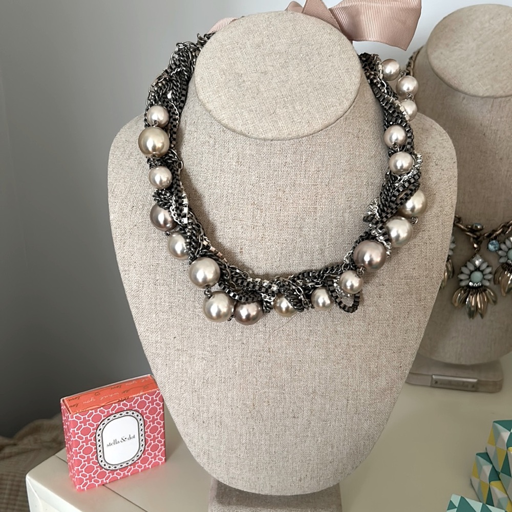 Multi strand necklace.Ribbon tie. The ribbon is discolored see photos